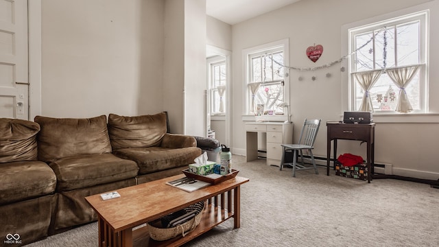 living room with a wealth of natural light and carpet flooring