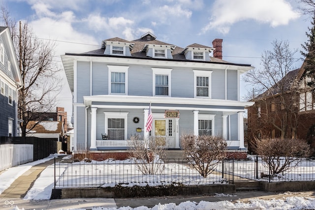 front of property featuring covered porch