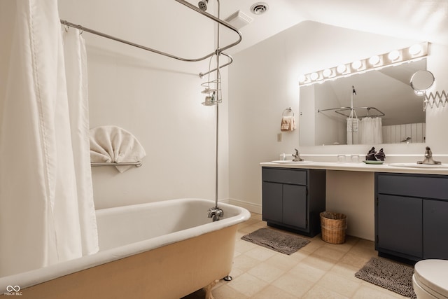 full bathroom featuring vanity, toilet, shower / bath combo with shower curtain, and lofted ceiling