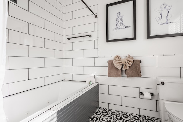 full bathroom featuring tile patterned flooring, toilet, and tile walls