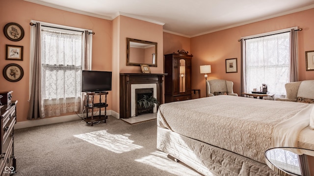 carpeted bedroom with a brick fireplace, baseboards, and ornamental molding