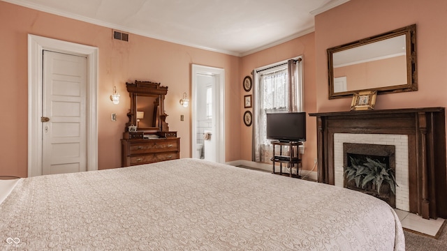 bedroom with a brick fireplace, visible vents, and ornamental molding