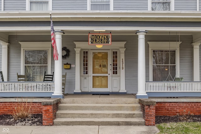 property entrance with covered porch