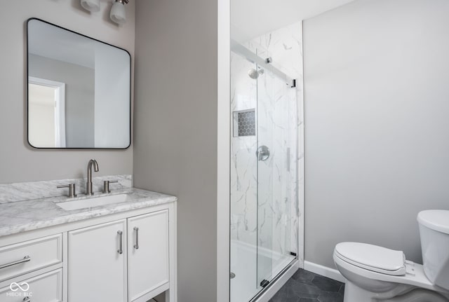 bathroom with vanity, toilet, and walk in shower