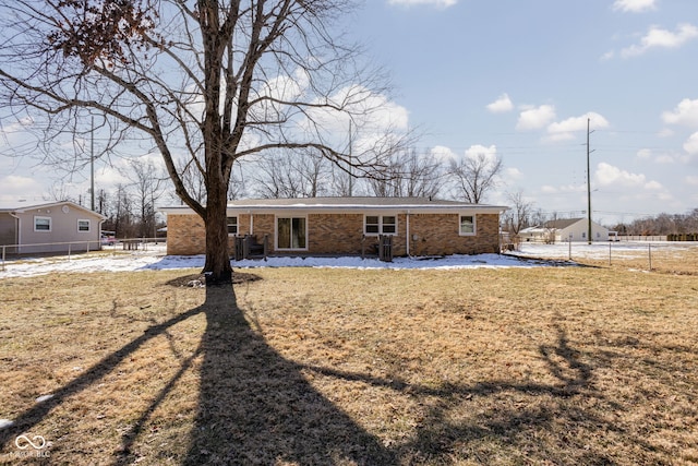 rear view of house with a yard