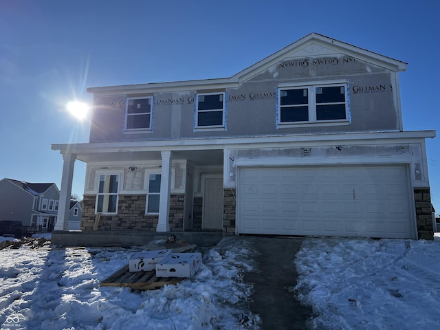 view of front of home featuring a garage and covered porch