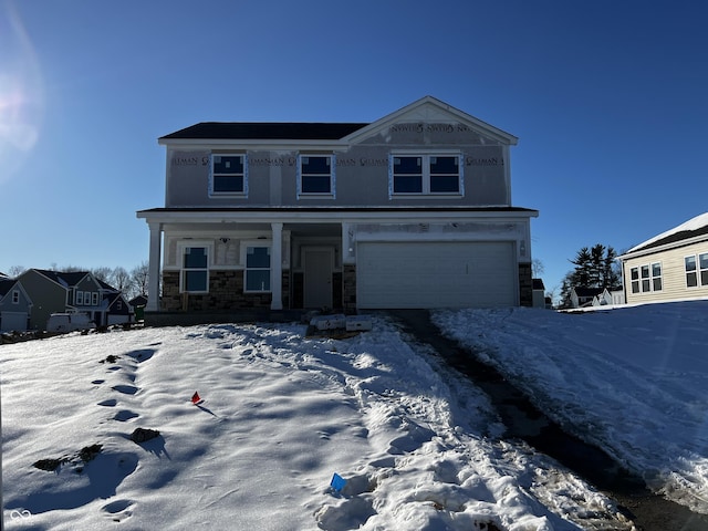 view of front facade featuring a garage and covered porch