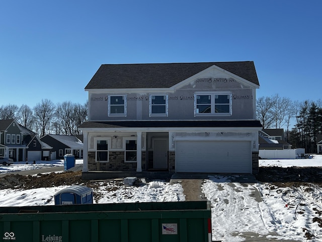 view of front of property with a garage