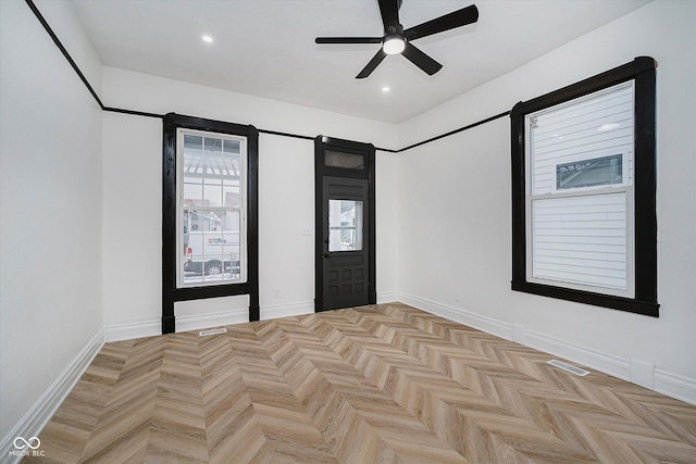 interior space featuring ceiling fan and light parquet floors