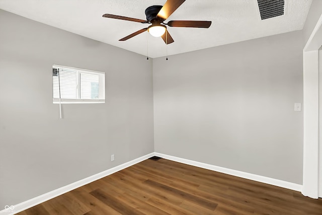 spare room featuring ceiling fan and wood-type flooring