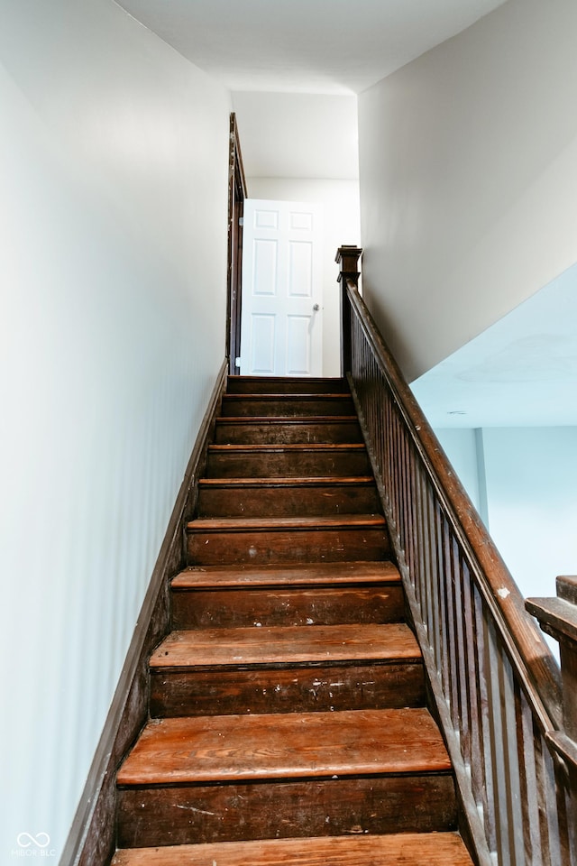 stairway featuring hardwood / wood-style flooring