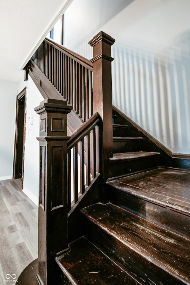 stairway featuring hardwood / wood-style floors