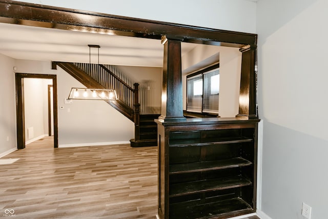 stairway with hardwood / wood-style flooring