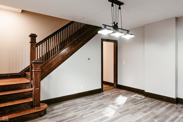 unfurnished dining area with light wood-type flooring