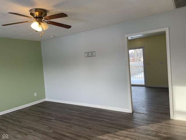 unfurnished room featuring ceiling fan, a textured ceiling, and dark hardwood / wood-style flooring