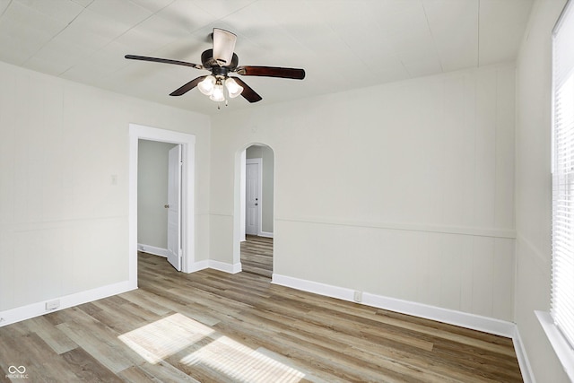 spare room featuring ceiling fan and light hardwood / wood-style flooring