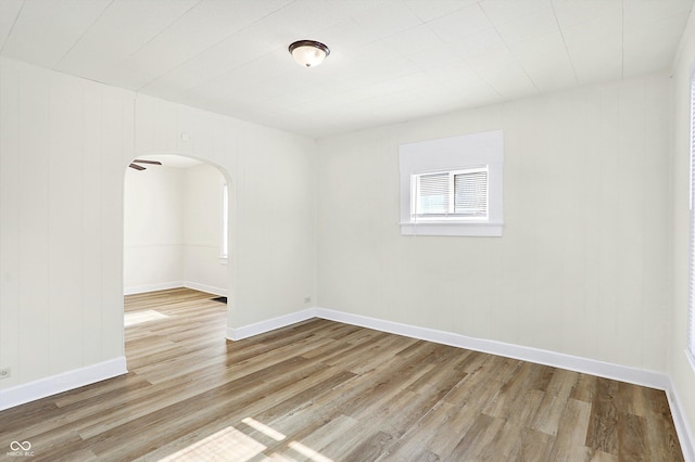 unfurnished room with hardwood / wood-style floors