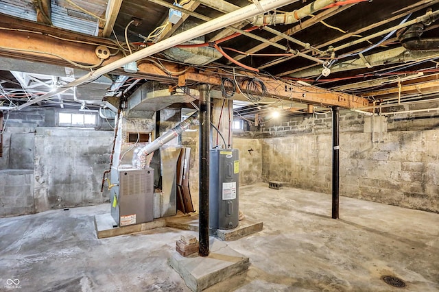 basement featuring heating unit and water heater