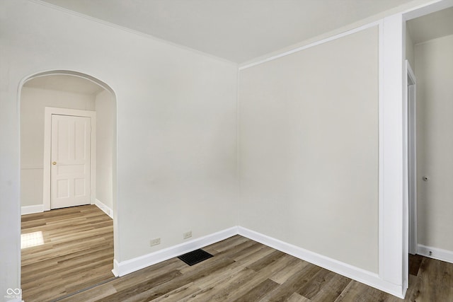 empty room with wood-type flooring