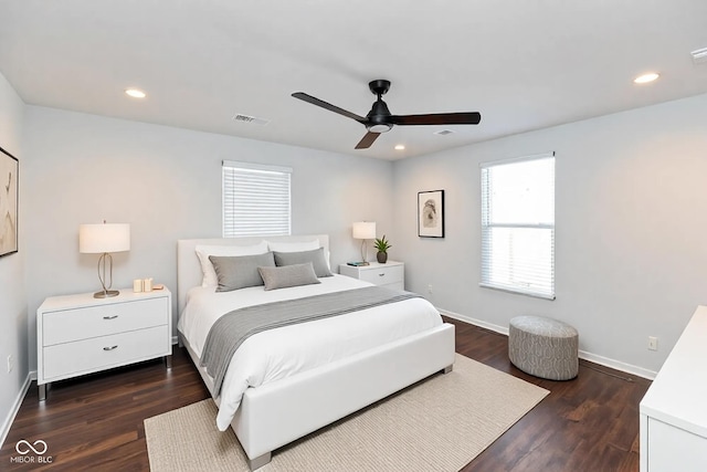 bedroom with ceiling fan and dark wood-type flooring