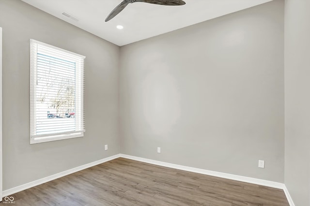 empty room featuring wood-type flooring and ceiling fan