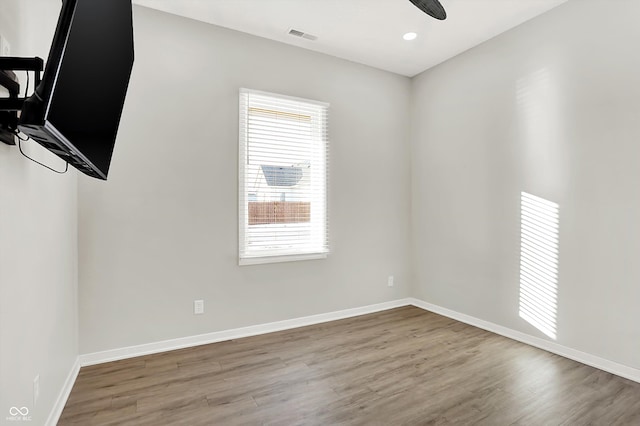 unfurnished room featuring ceiling fan and wood-type flooring