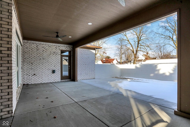 snow covered patio with ceiling fan