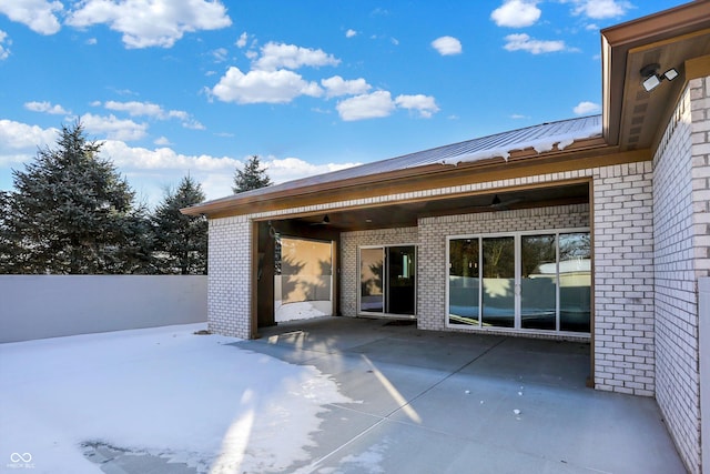 snow covered patio with ceiling fan