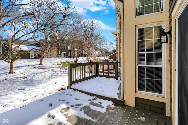 view of snow covered deck