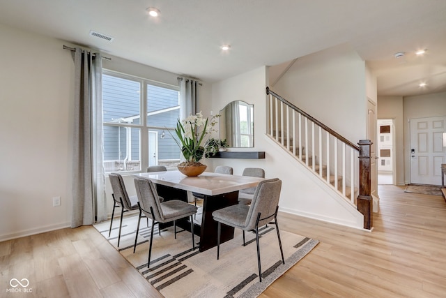 dining space featuring light wood-type flooring