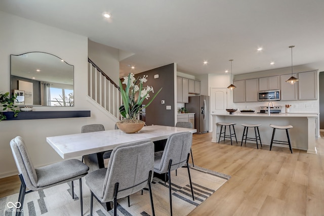 dining room with light hardwood / wood-style flooring