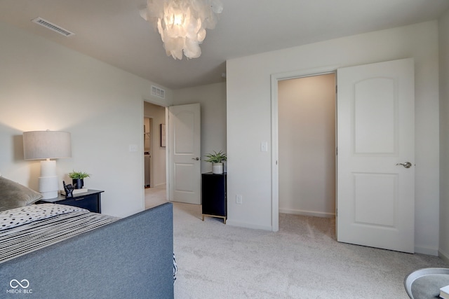 bedroom with light colored carpet