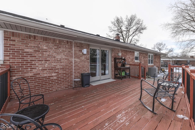 wooden deck with central air condition unit