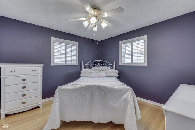 bedroom featuring light wood-type flooring and ceiling fan