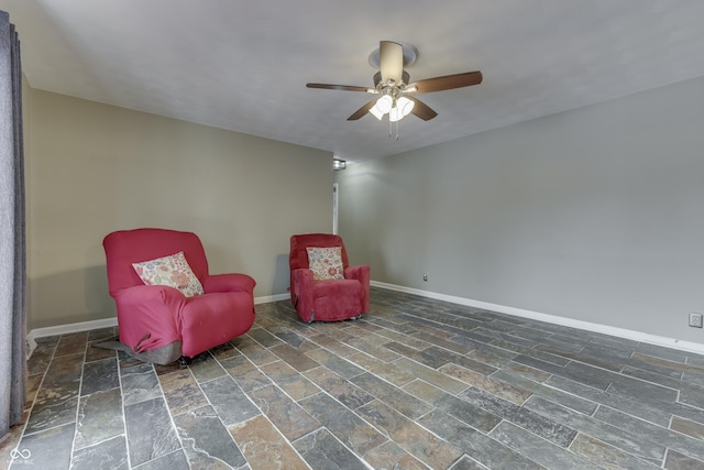 living area with ceiling fan