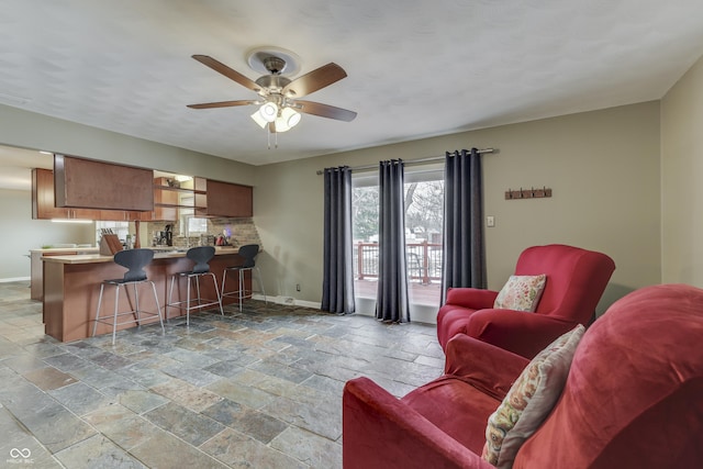 living room with ceiling fan