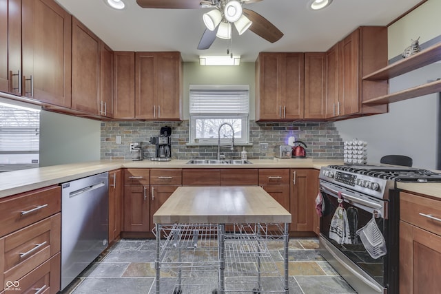 kitchen with sink, backsplash, ceiling fan, and stainless steel appliances