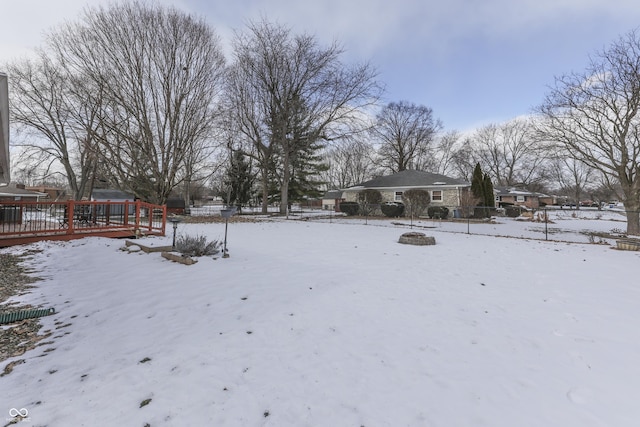 view of yard layered in snow