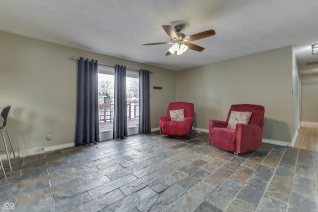 sitting room featuring ceiling fan