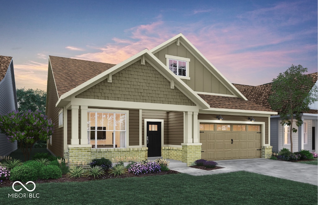 craftsman-style house with a garage, a lawn, and a porch