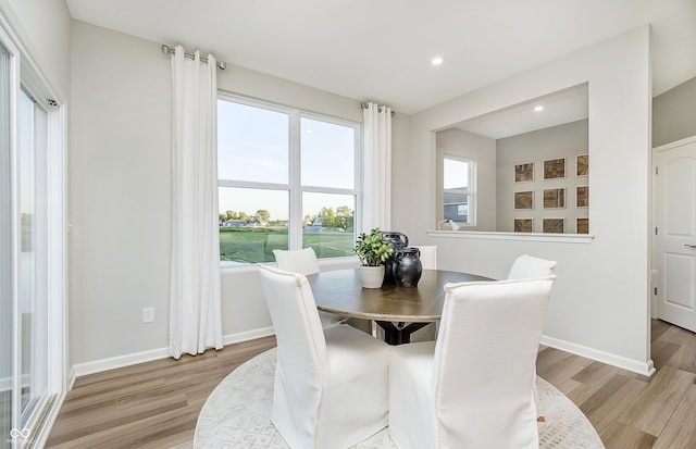 dining area featuring light wood-type flooring