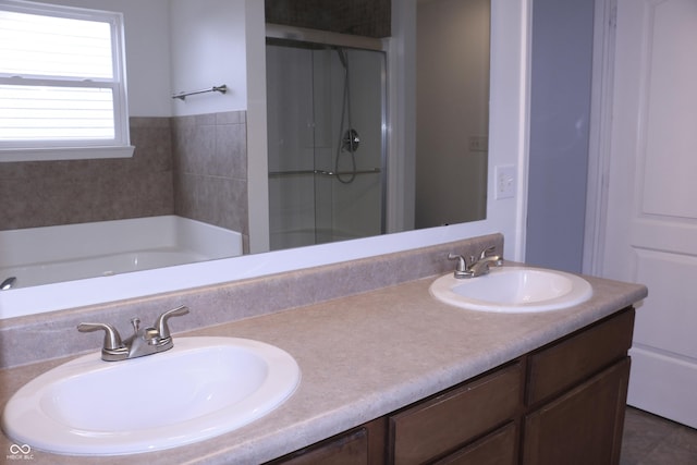 bathroom with independent shower and bath and vanity