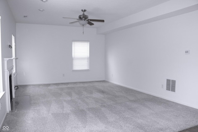 carpeted empty room with ceiling fan