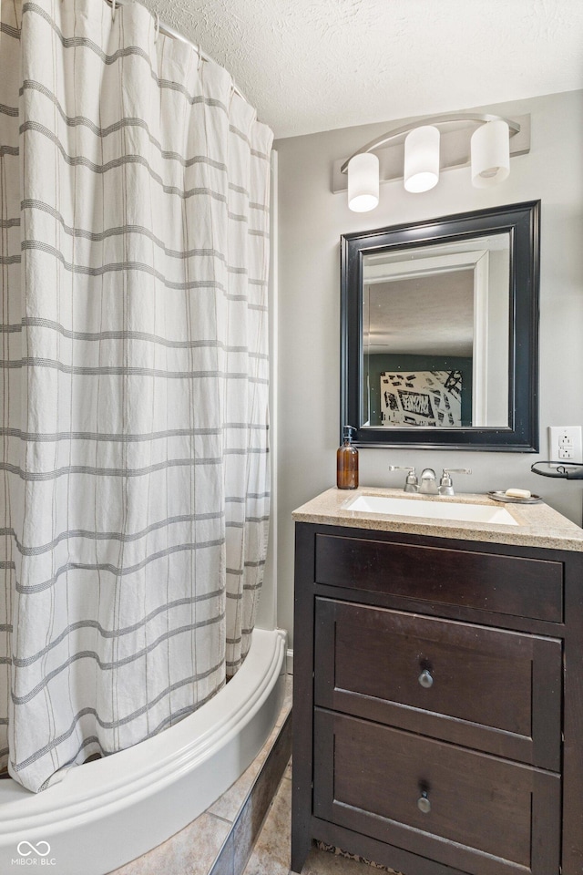 bathroom featuring vanity and a textured ceiling