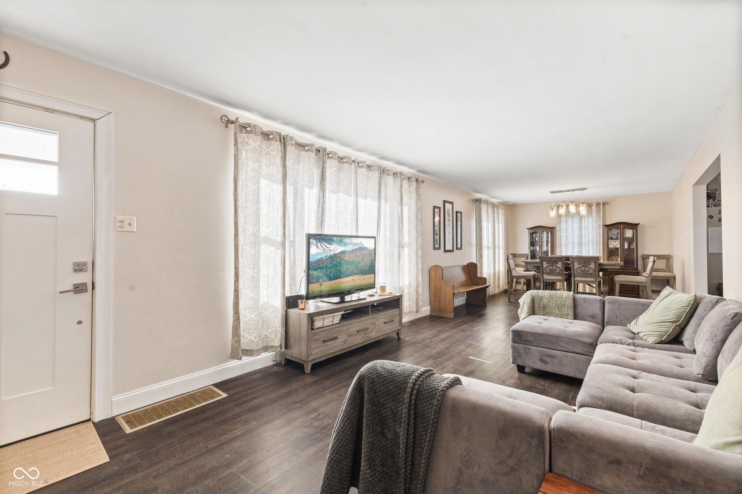 living room with dark hardwood / wood-style floors