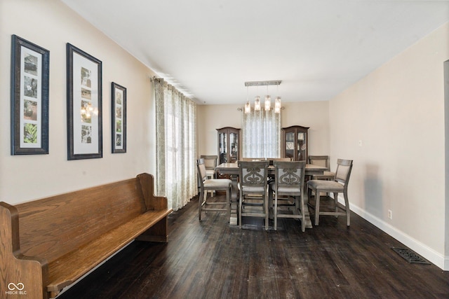 dining room with dark hardwood / wood-style floors