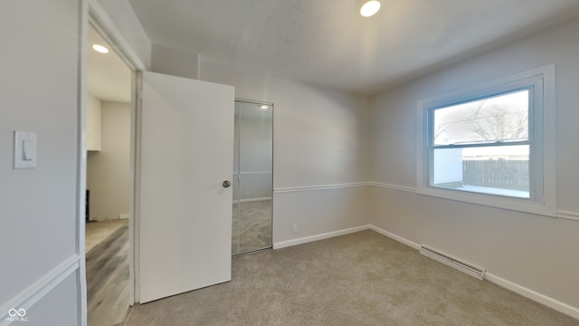 unfurnished bedroom with light carpet