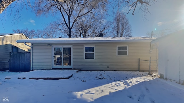 view of snow covered house