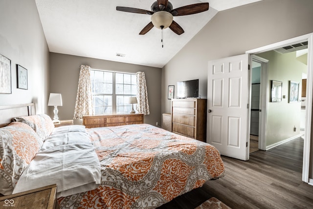 bedroom with vaulted ceiling, ceiling fan, and dark hardwood / wood-style flooring