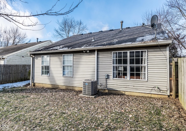 back of property with central AC unit